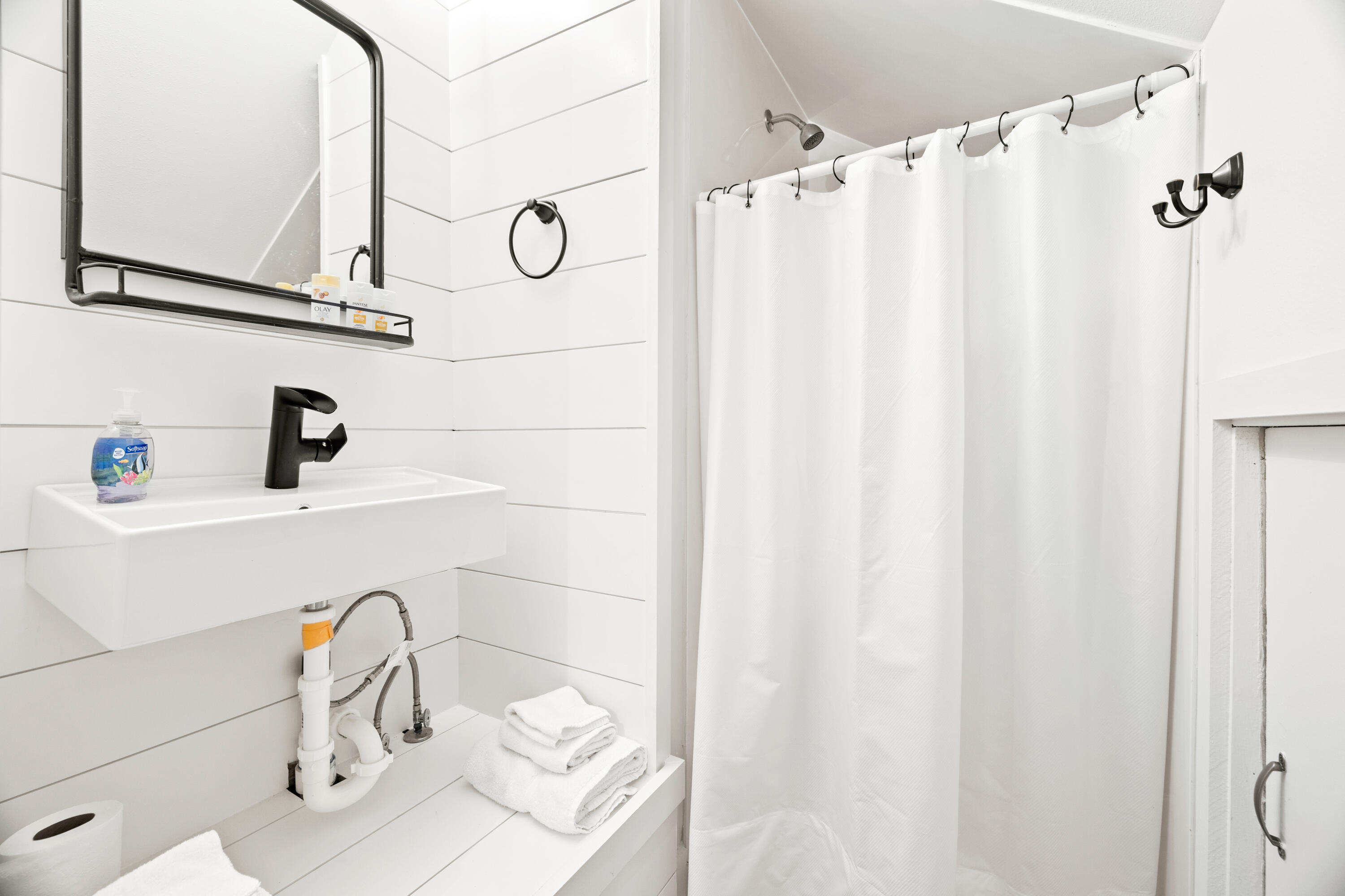 65 Brown Street Santa Rosa Beach, FL 32459 - Photo 28 of 43 a bathroom with a sink and a mirror