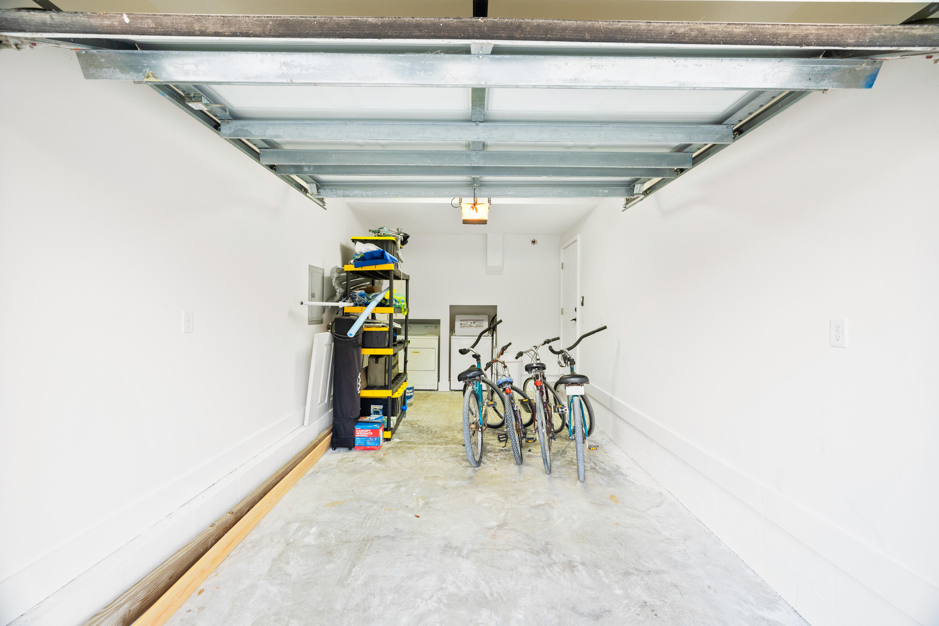 65 Brown Street Santa Rosa Beach, FL 32459 - Photo 29 of 43 a view of a garage with a white house