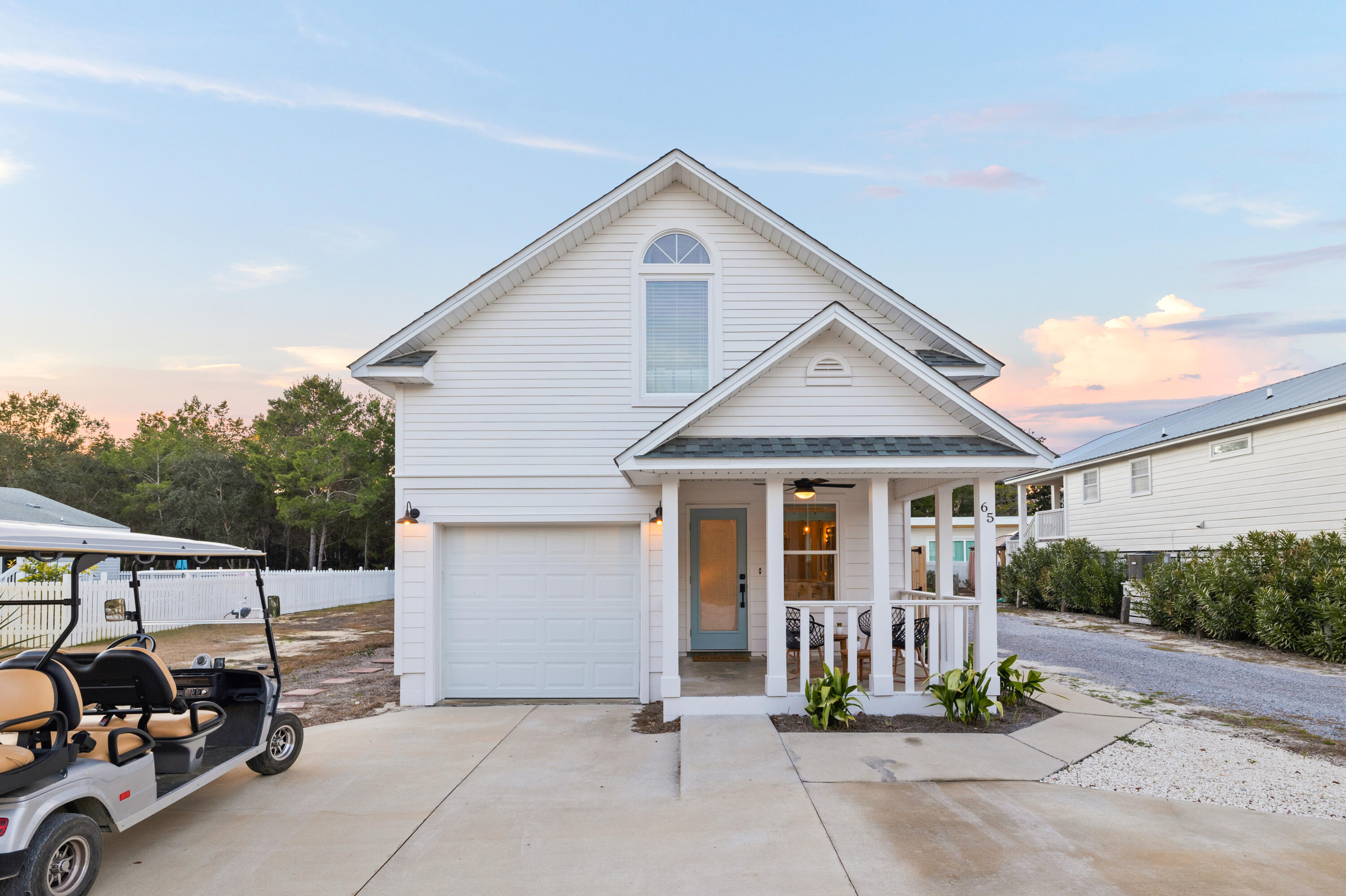65 Brown Street Santa Rosa Beach, FL 32459 - Photo 37 of 43 a front view of a house with a yard