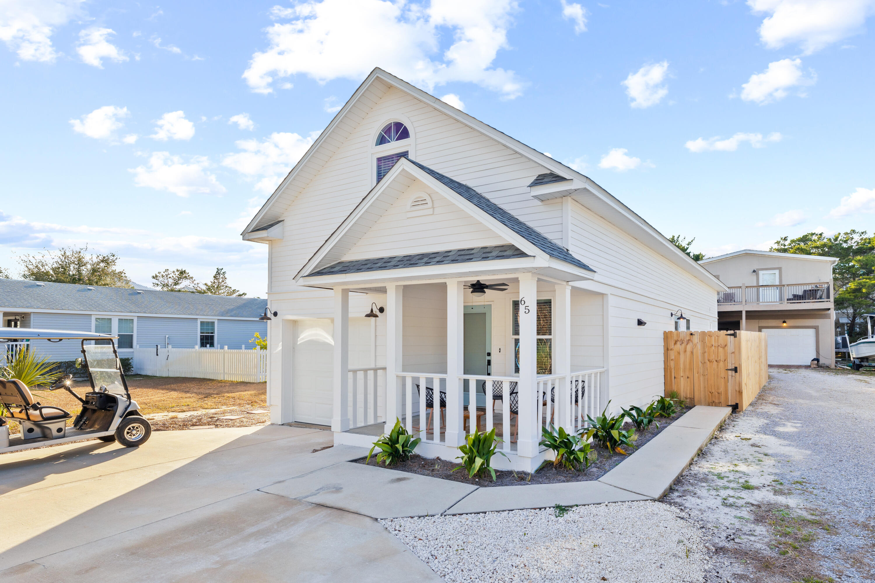 65 Brown Street Santa Rosa Beach, FL 32459 - Photo 42 of 43 a front view of a house with garden