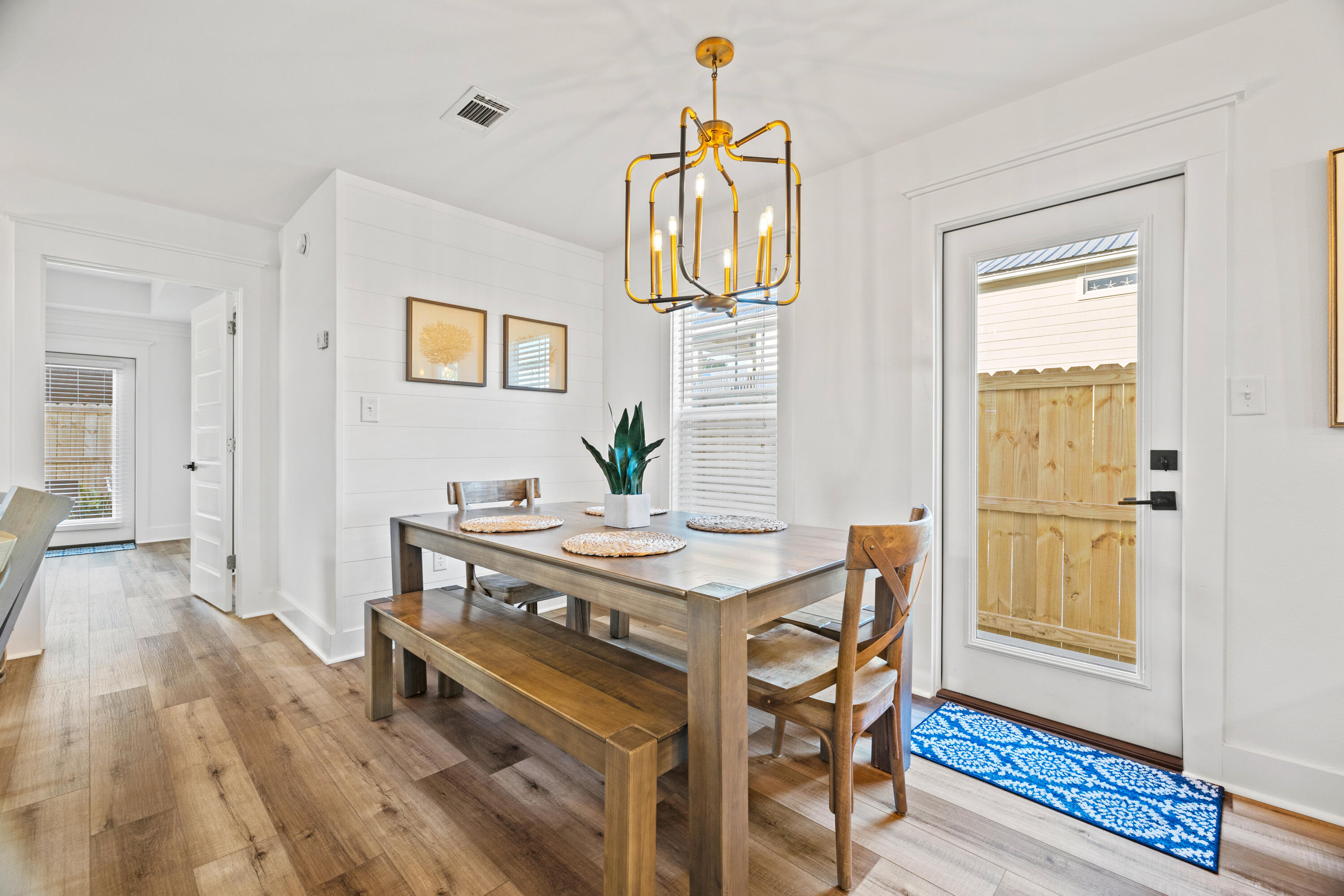 65 Brown Street Santa Rosa Beach, FL 32459 - Photo 8 of 43 a view of a dining room with furniture and wooden floor