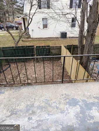 a view of a room with wooden fence