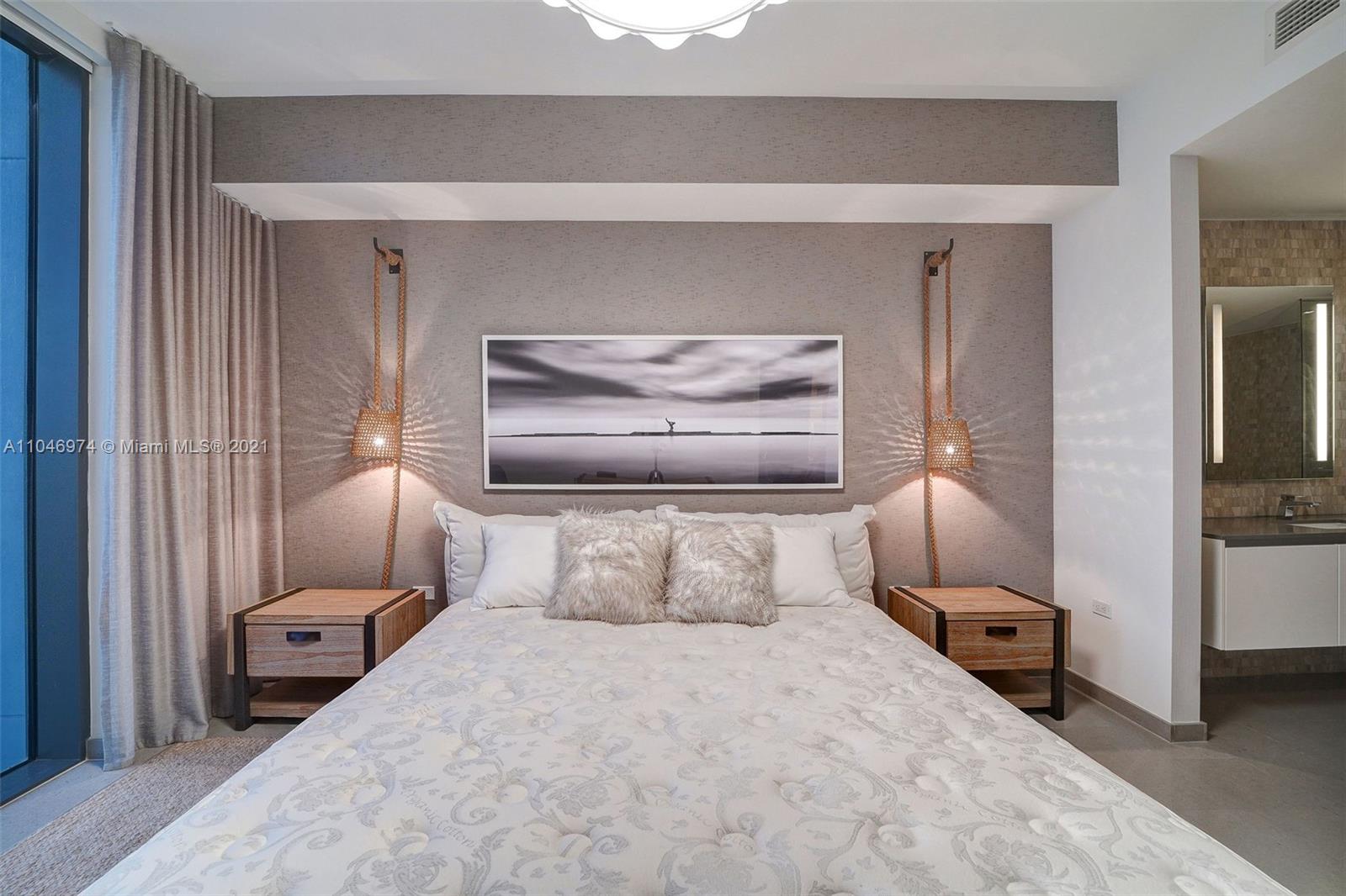 88 Southwest 7th Street, Unit 1904 Miami, FL 33130 - Photo 15 of 28 a bedroom with a bed and a view of bathroom