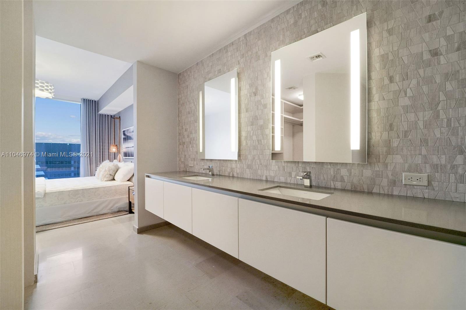 88 Southwest 7th Street, Unit 1904 Miami, FL 33130 - Photo 22 of 28 a bathroom with a bathtub and a sink