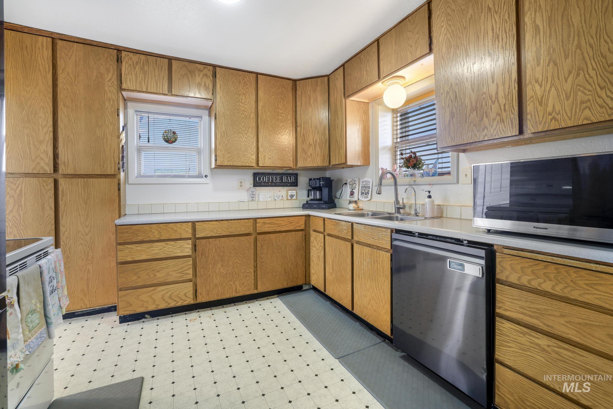 88 South 400 Road West Jerome, ID 83338 - Photo 12 of 31 Kitchen featuring light countertops, stainless steel appliances, wood finish cabinetry, and light flooring