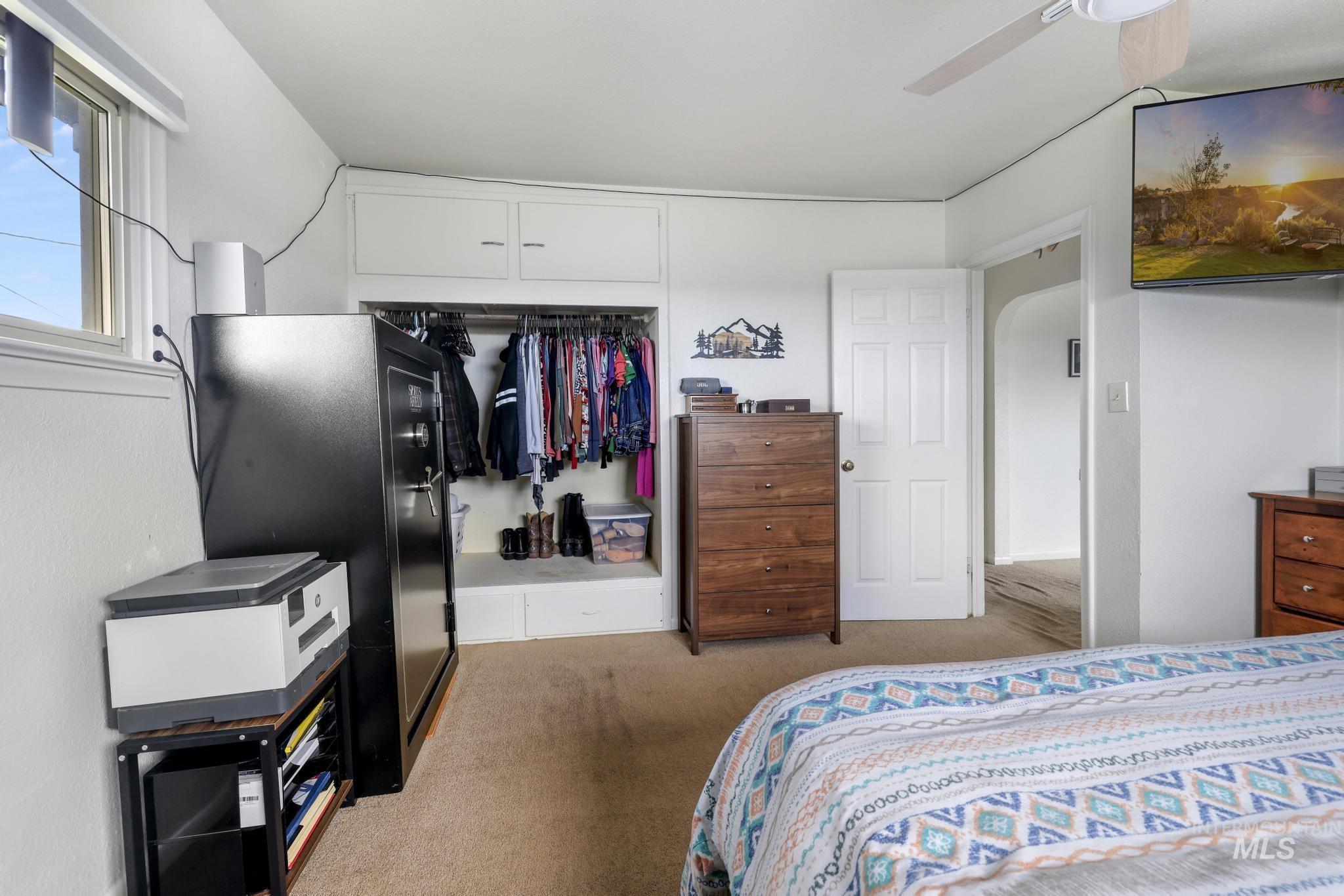 88 South 400 Road West Jerome, ID 83338 - Photo 21 of 31 Bedroom featuring a closet, light carpet, and a ceiling fan