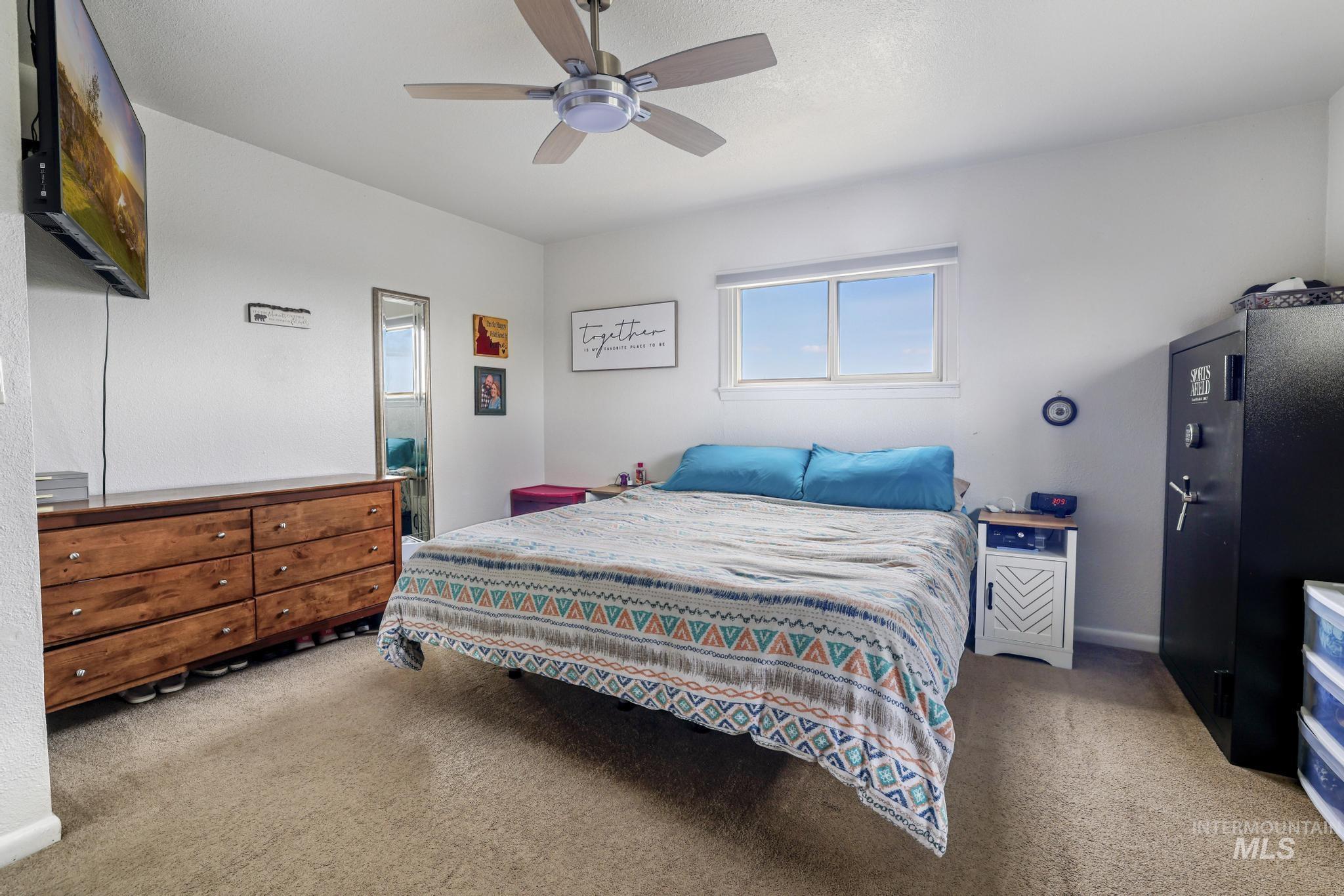 88 South 400 Road West Jerome, ID 83338 - Photo 23 of 31 Bedroom featuring light colored carpet and ceiling fan