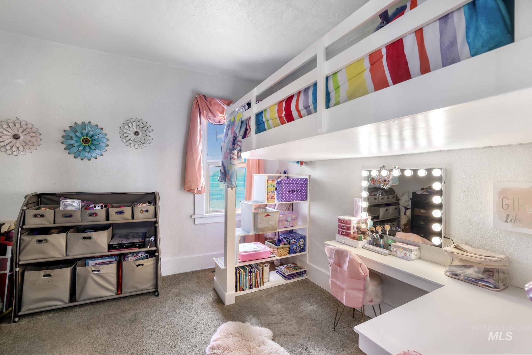 88 South 400 Road West Jerome, ID 83338 - Photo 24 of 31 Bedroom featuring light colored carpet and an office area