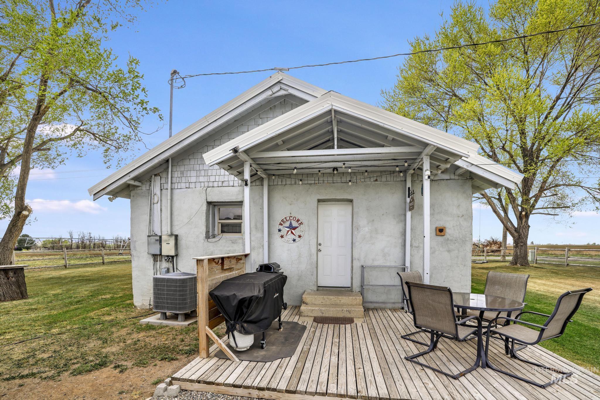 88 South 400 Road West Jerome, ID 83338 - Photo 28 of 31 Wooden terrace with outdoor dining area, a grill, and entry steps