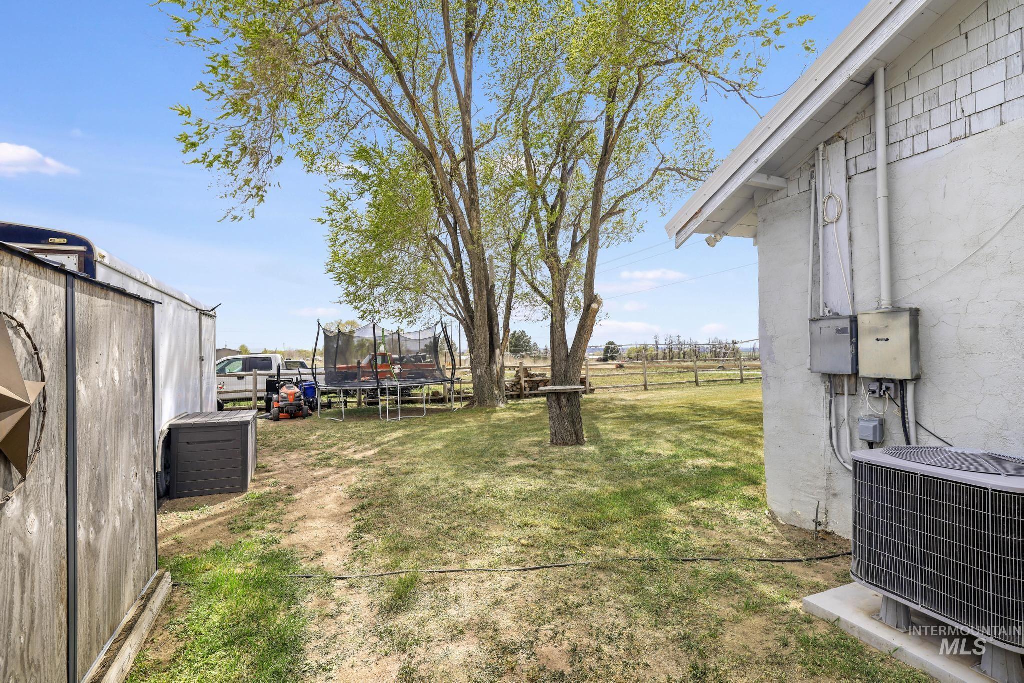 88 South 400 Road West Jerome, ID 83338 - Photo 29 of 31 Fenced backyard featuring a trampoline