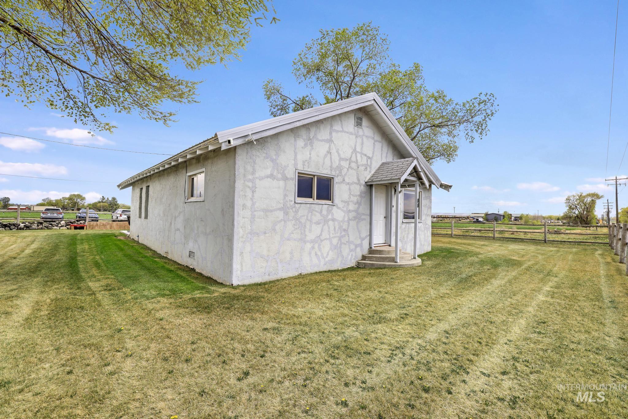 88 South 400 Road West Jerome, ID 83338 - Photo 3 of 31 Back of house featuring crawl space, entry steps, and stucco siding