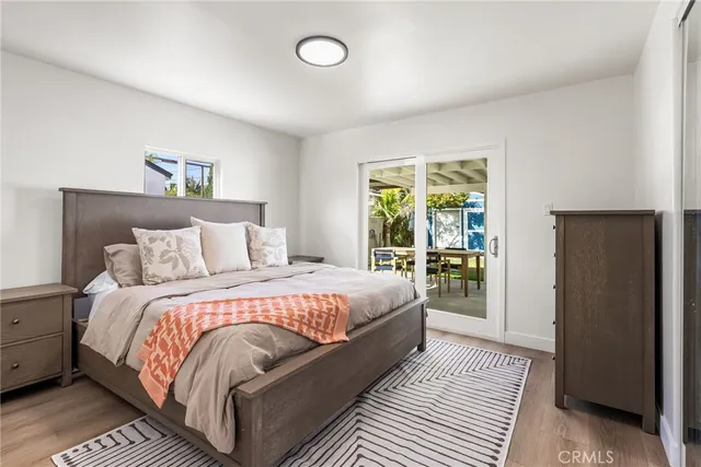 a bedroom with bed and a window