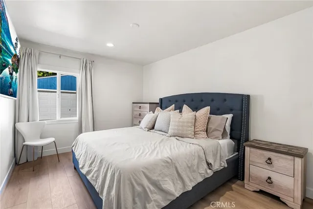 a bedroom with a bed and a chair