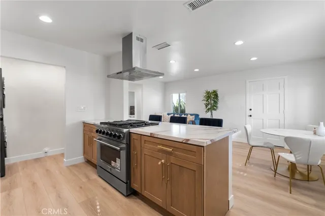 a kitchen with a stove and a table