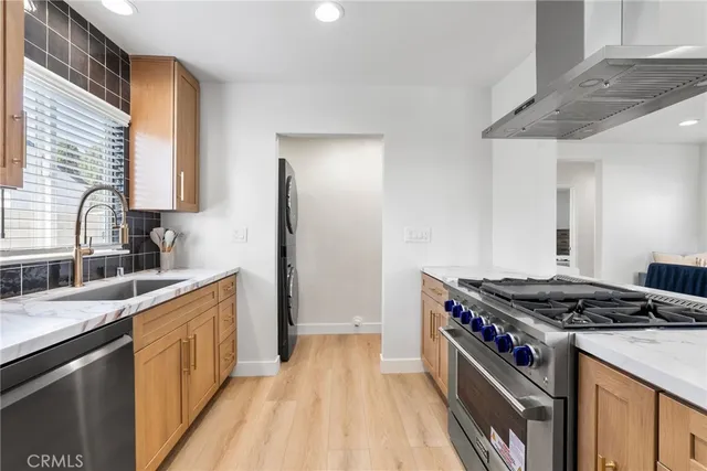 a kitchen with a stove and a sink