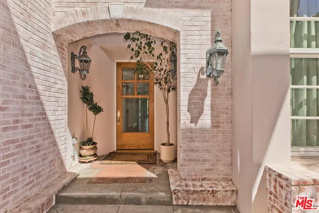 a living room with furniture large window and flat screen tv