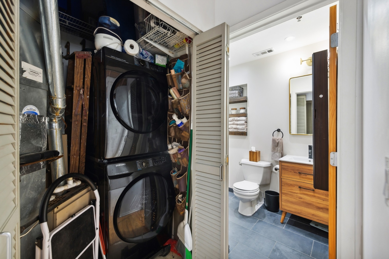 1500 West Monroe Street, Unit 306 Chicago, IL 60607 - Photo 11 of 13 a bathroom with a toilet a sink and a mirror