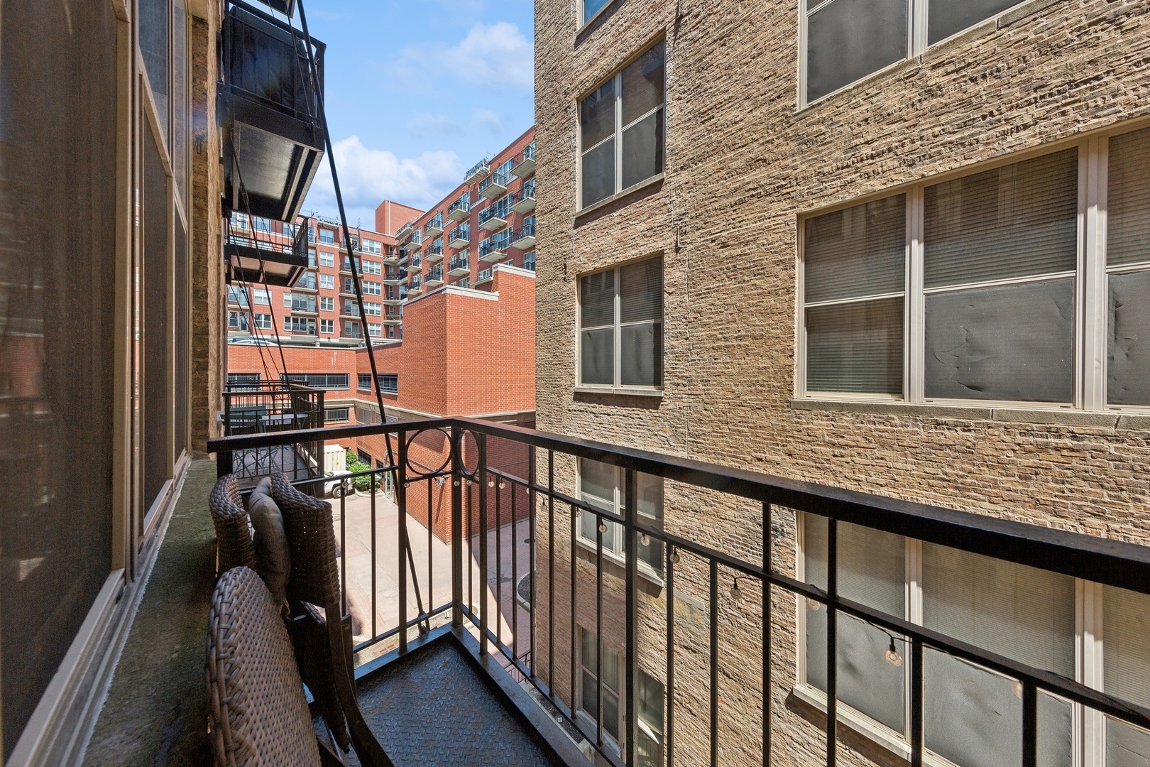 1500 West Monroe Street, Unit 306 Chicago, IL 60607 - Photo 12 of 13 a view of a brick house with large windows