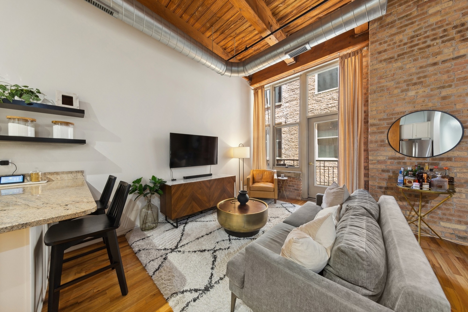 1500 West Monroe Street, Unit 306 Chicago, IL 60607 - Photo 3 of 13 a living room with furniture a flat screen tv and floor to ceiling window