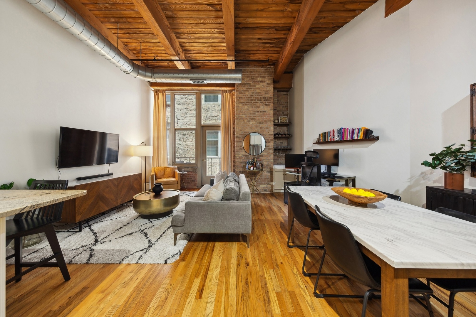 1500 West Monroe Street, Unit 306 Chicago, IL 60607 - Photo 4 of 13 a living room with furniture and flat screen tv