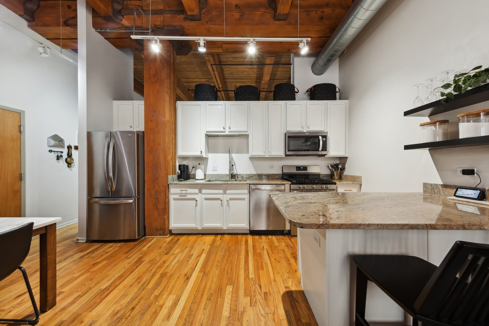 1500 West Monroe Street, Unit 306 Chicago, IL 60607 - Photo 5 of 13 a kitchen with a refrigerator and a stove top oven