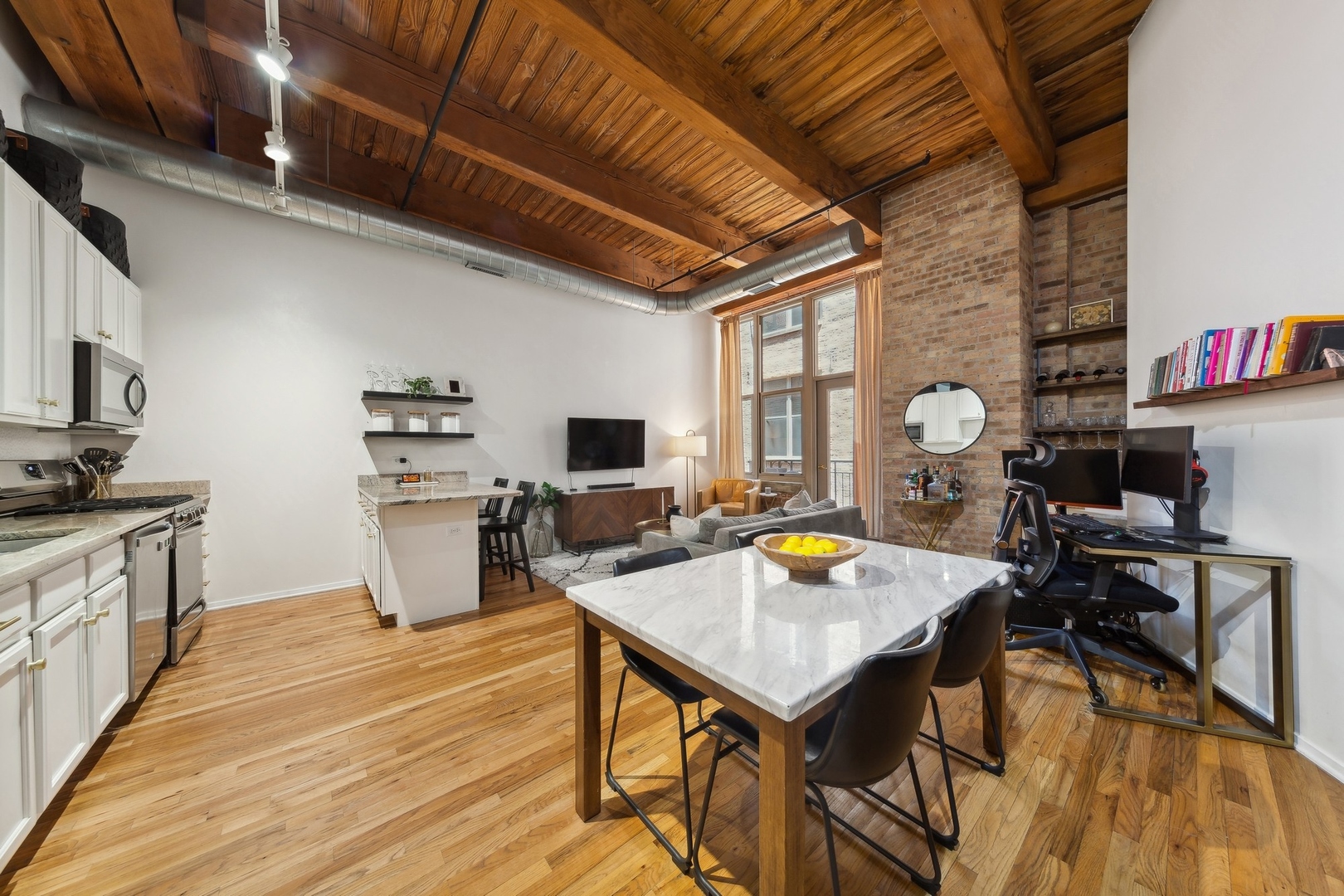 1500 West Monroe Street, Unit 306 Chicago, IL 60607 - Photo 6 of 13 a living room with stainless steel appliances furniture stove and a kitchen view