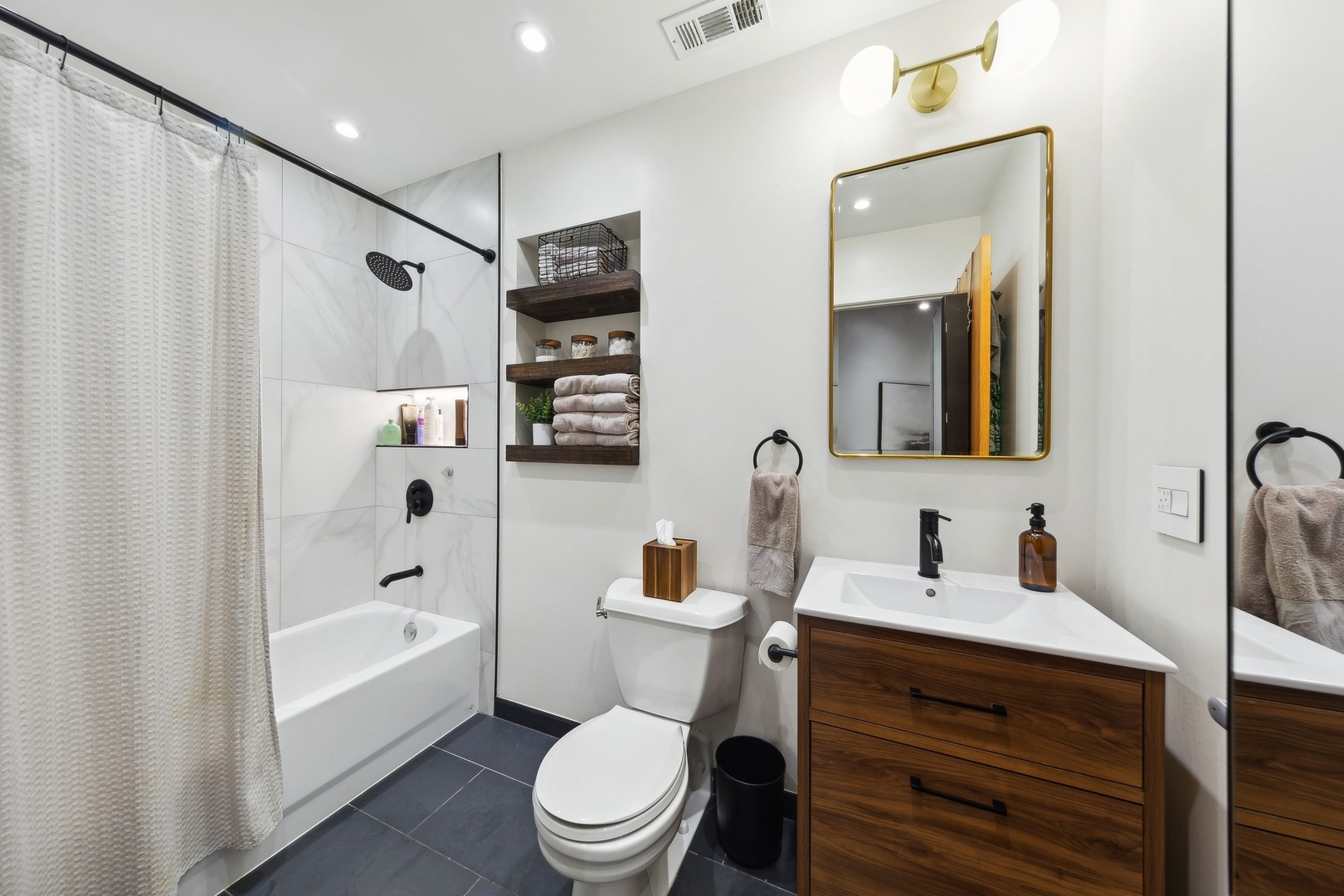 1500 West Monroe Street, Unit 306 Chicago, IL 60607 - Photo 10 of 13 a bathroom with a sink a toilet and shower