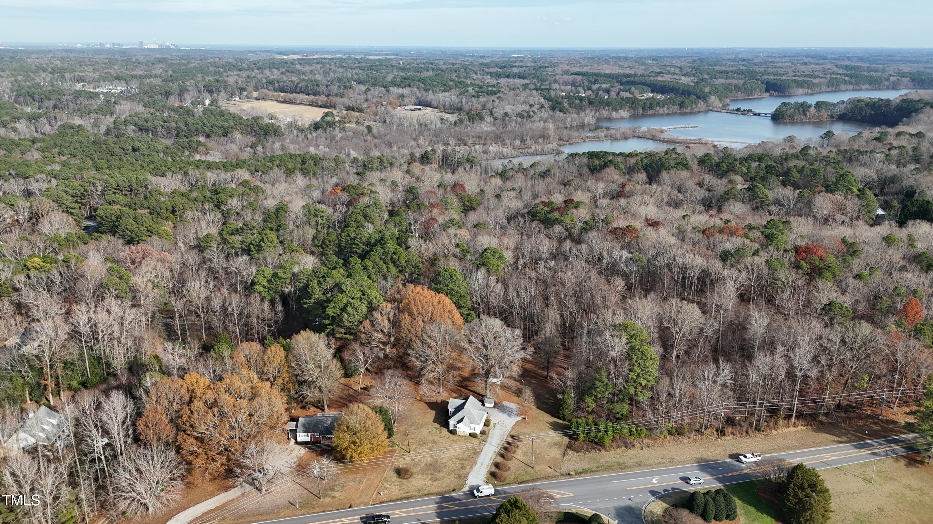 8014 Penny Road Raleigh, NC 27606 - Photo 8 of 8 a view of a dry yard with trees