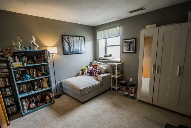 a room with furniture and a book shelf