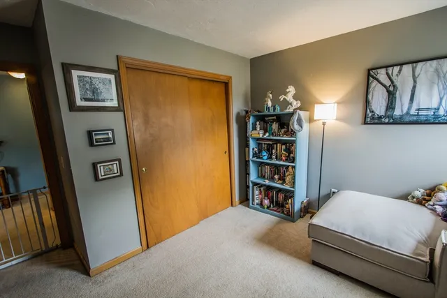 a bedroom with a bed and furniture