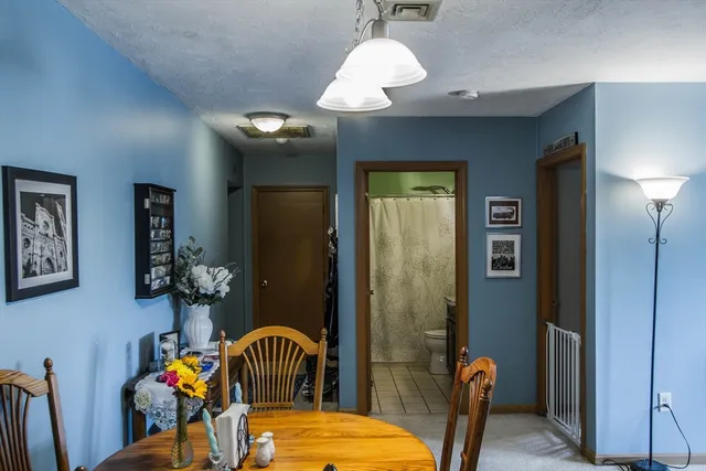 a bedroom with furniture and a chandelier