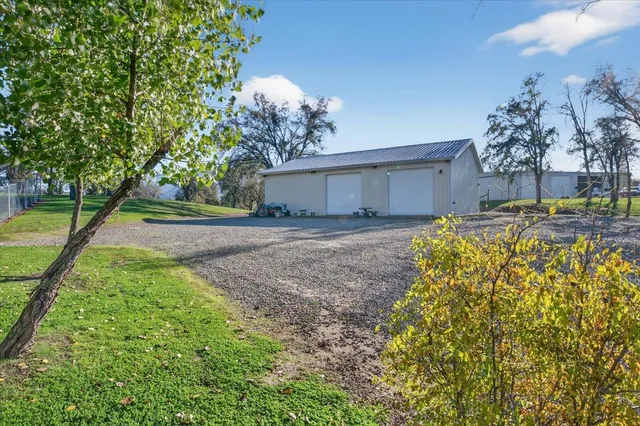 a view of a dining room with furniture and a chandelier