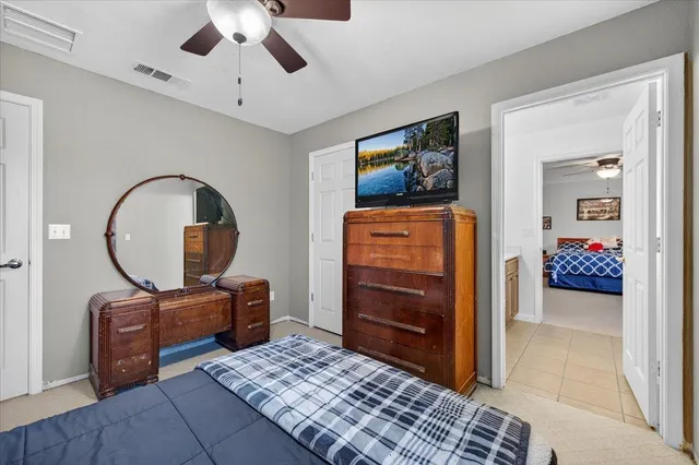 a view of walk in closet with clothes
