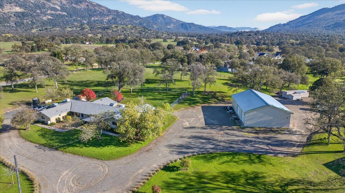 35102 Quail Oak Road Auberry, CA 93602 - Photo 3 of 61 an aerial view of a house with a garden and lake view