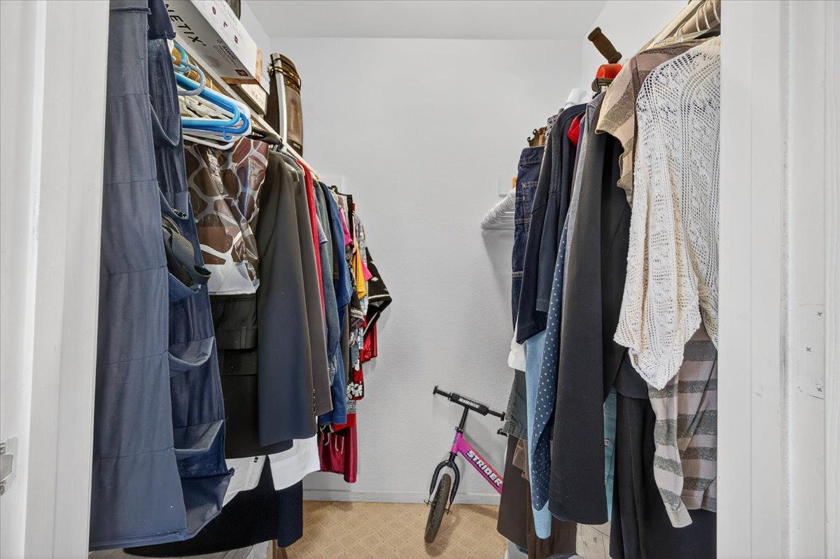 35102 Quail Oak Road Auberry, CA 93602 - Photo 32 of 61 a view of walk in closet with clothes and shoes