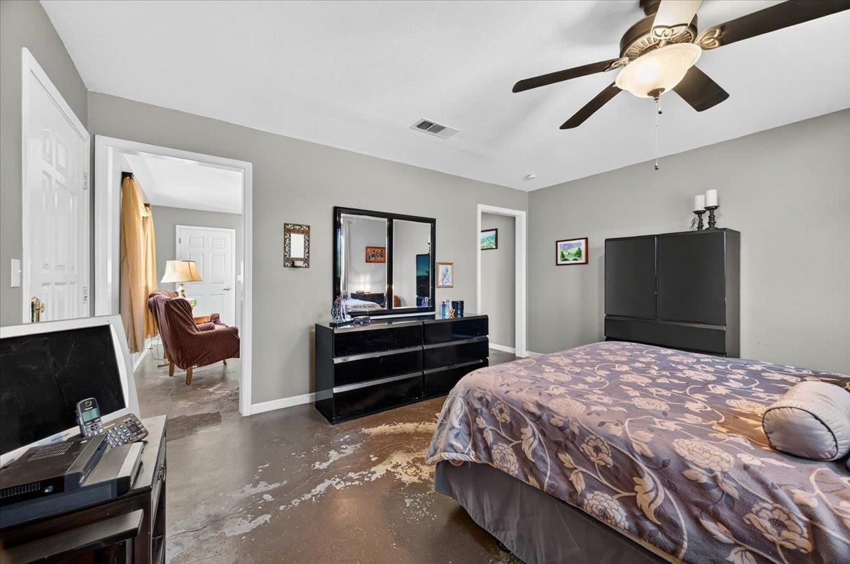 35102 Quail Oak Road Auberry, CA 93602 - Photo 39 of 61 a bedroom with a bed and a chandelier