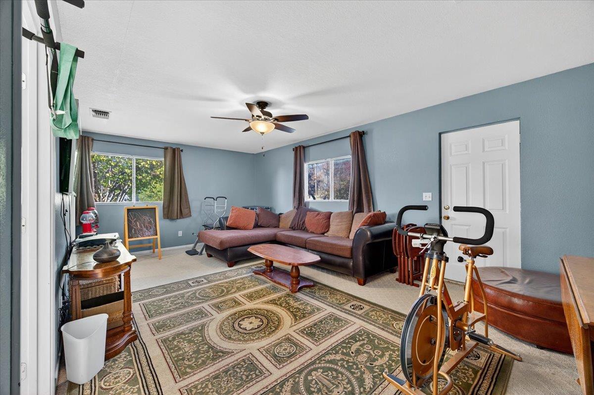 35102 Quail Oak Road Auberry, CA 93602 - Photo 43 of 61 a living room with furniture a chandelier and a window