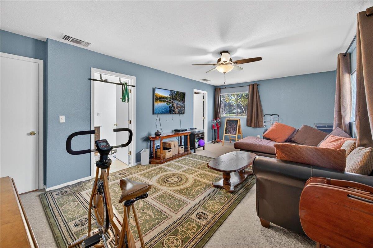35102 Quail Oak Road Auberry, CA 93602 - Photo 44 of 61 a living room with furniture a chandelier and a rug