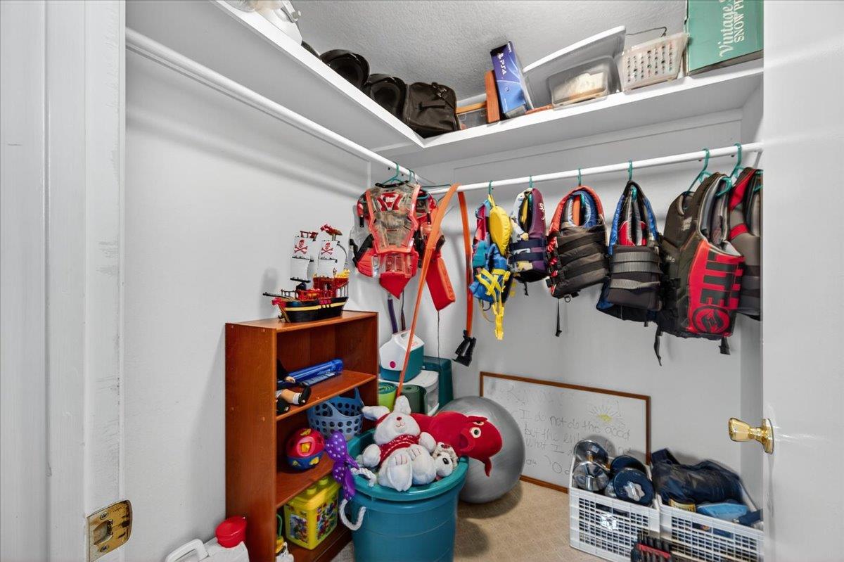 35102 Quail Oak Road Auberry, CA 93602 - Photo 46 of 61 a store room with lots of different colored cloths