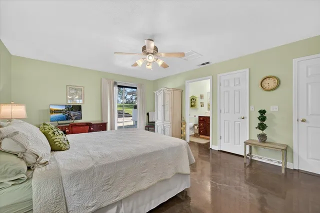 a view of a patio with table and chairs under an umbrella