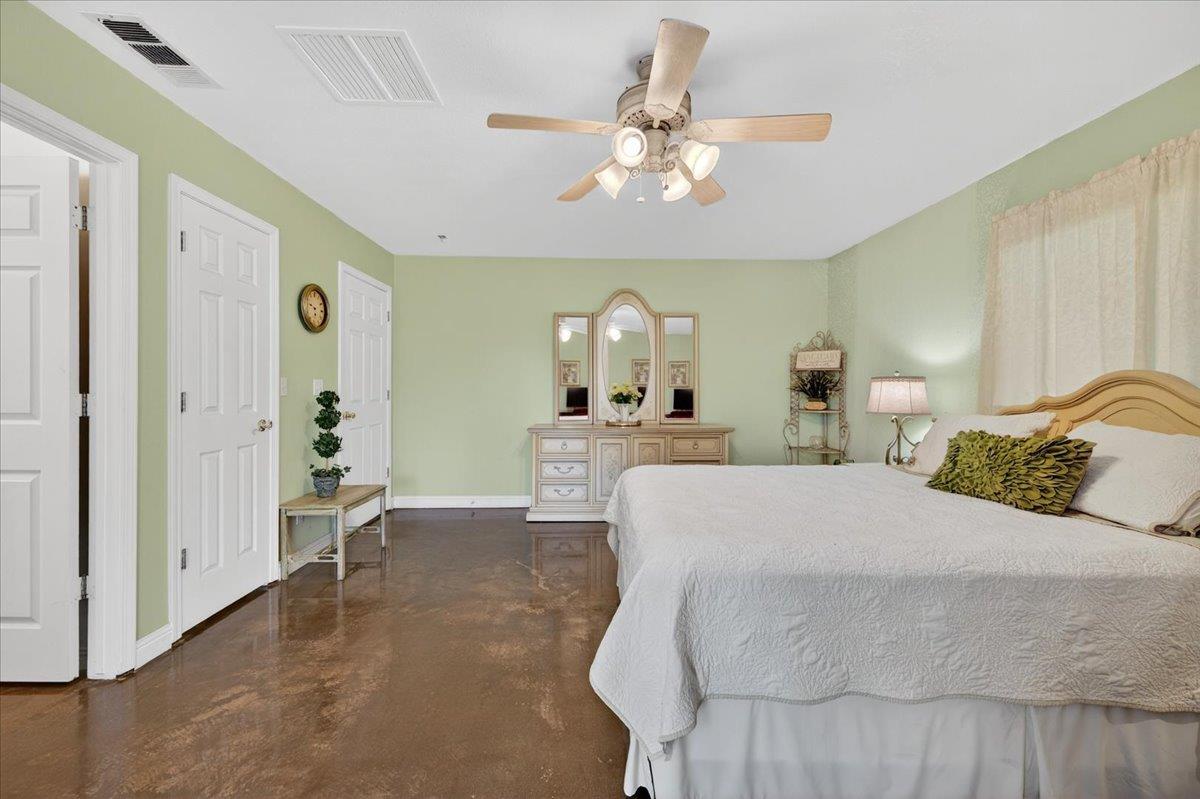 35102 Quail Oak Road Auberry, CA 93602 - Photo 49 of 61 a bedroom with a bed and a chandelier