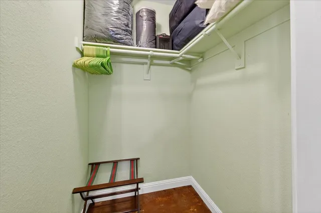 an aerial view of a house with a garden and swimming pool