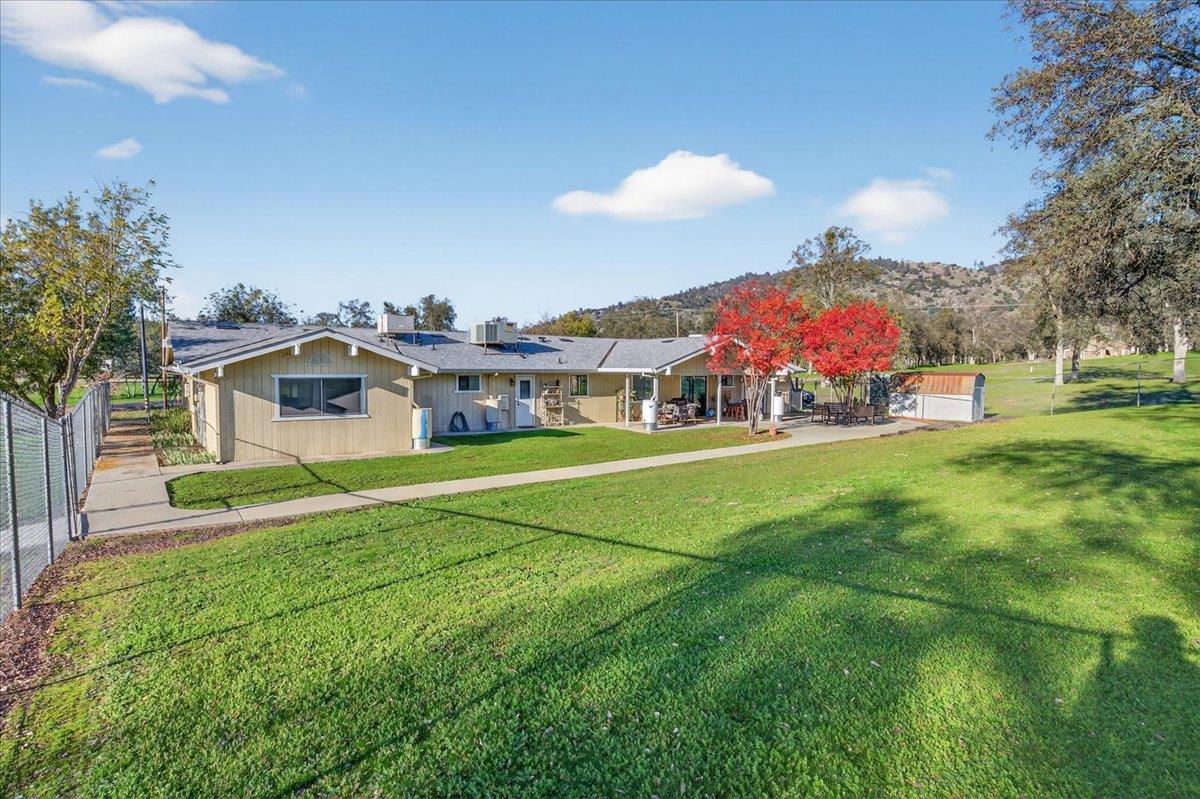 35102 Quail Oak Road Auberry, CA 93602 - Photo 55 of 61 a front view of house with yard and trees in the background
