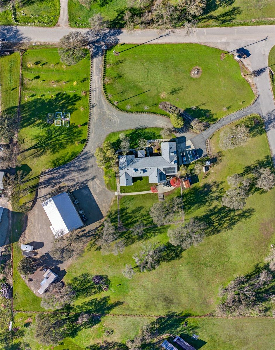 35102 Quail Oak Road Auberry, CA 93602 - Photo 60 of 61 an aerial view of a house with a garden and swimming pool