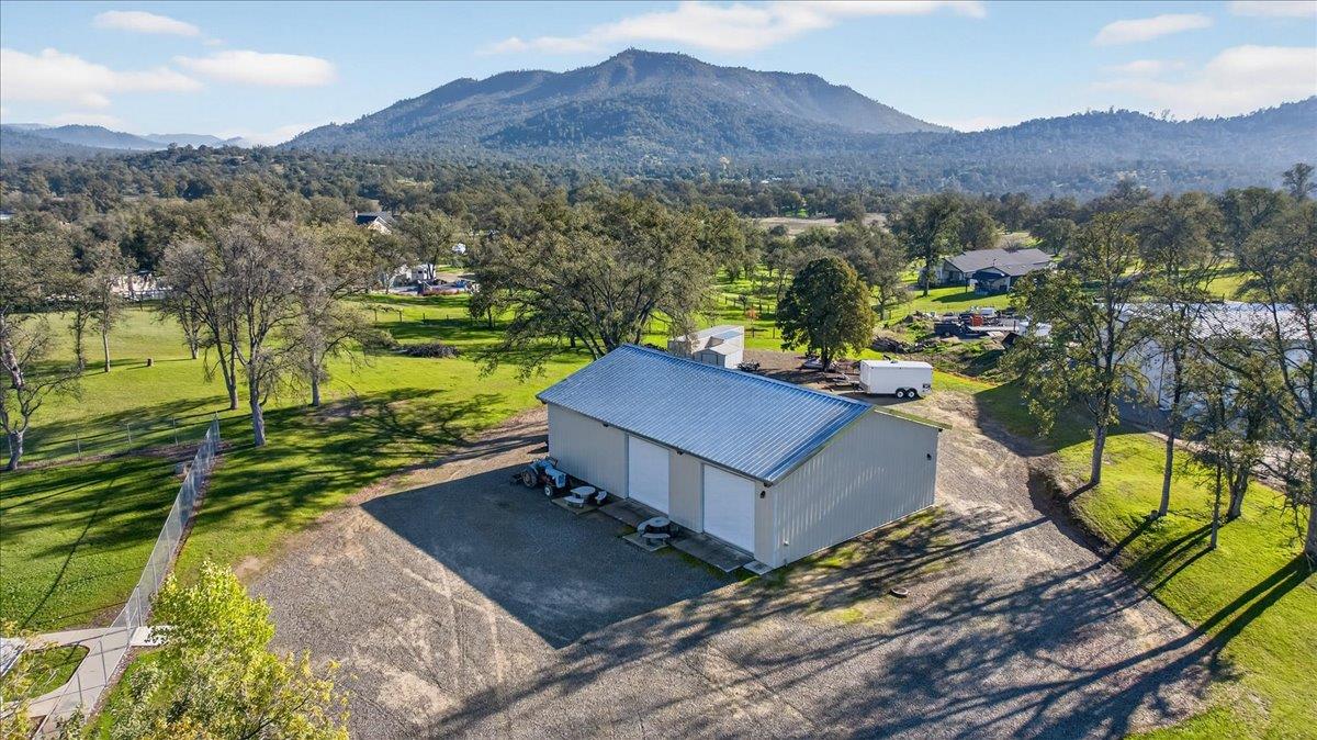 35102 Quail Oak Road Auberry, CA 93602 - Photo 6 of 61 a view of a house with a yard and a mountain view