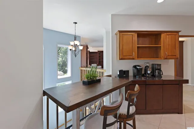 a kitchen with a table and chairs in it