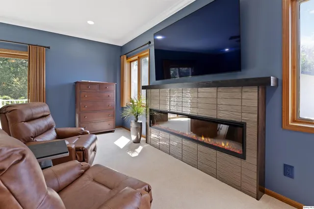 a living room with furniture and a fireplace