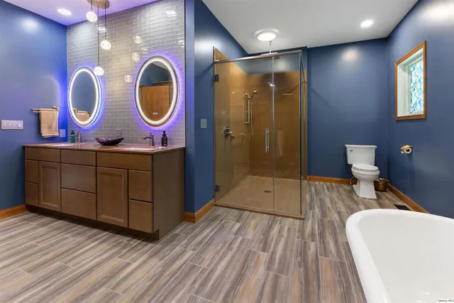 a bathroom with a sink mirror and vanity
