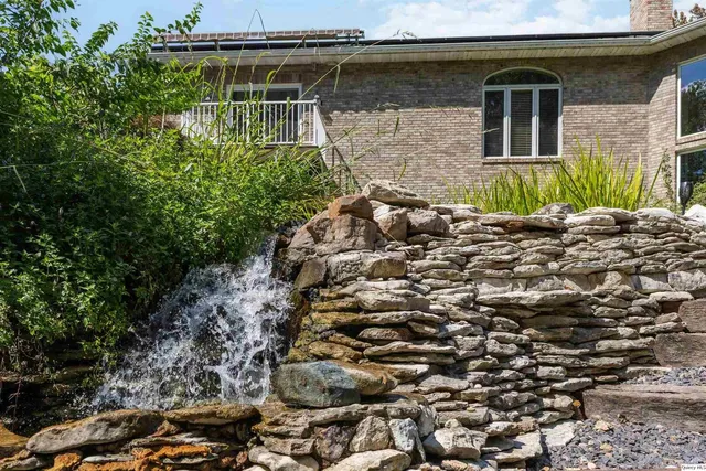 a front view of a building with garden