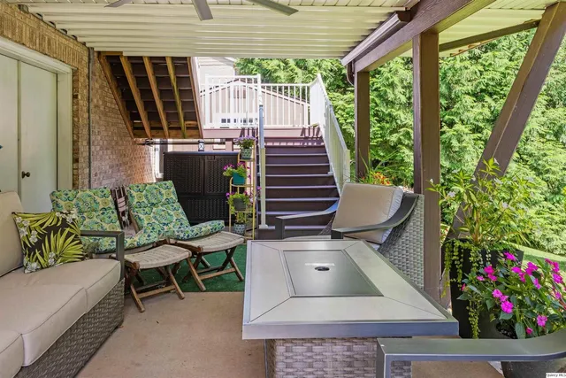a front view of a house with a garden and plants